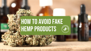 hemp flower and hemp bottles on a wooden table with text that reads "how to avoid fake hemp products"
