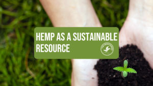 a person cupping a hemp seedling outside over some grass with text that reads "hemp as a sustainable resource" for earth day